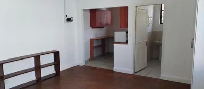 a small room with a kitchen and a hallway at Kwa George in Pretoria