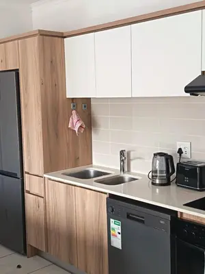 a kitchen with a sink and a counter top at The Blyde Cozy 1-Bedroom in Pretoria