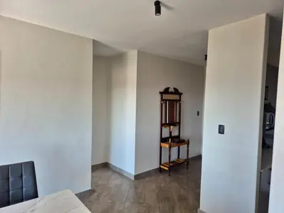 an empty room with white walls and a shelf at One at Corridor in Witbank