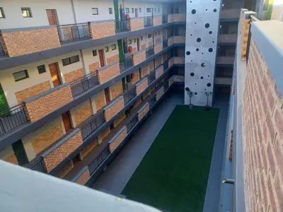 an image of an apartment building with a climbing wall at One at Corridor in Witbank