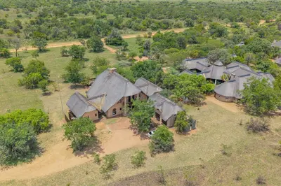 an aerial view of a house with trees at Bushveld Haven - Golf, Spa & Safari Lodge Stay in Warmbaths
