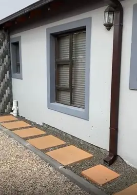 a building with a window on the side of it at 26 Rubens apartments in Secunda