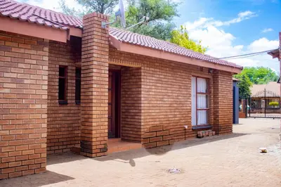 a brick building with a door and a window at Travel Shift Accommodation in Northam