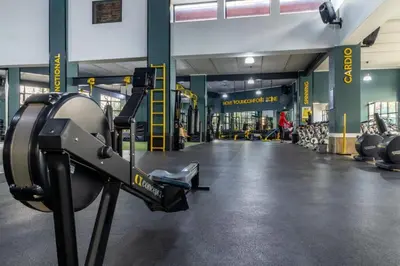 a gym with a machine in the middle of a room at The Blyde Estate Apartments in Pretoria