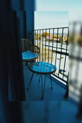 a balcony with a table and a chair and a view at Lynwood Circa 209 in Pretoria