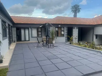 a patio in the backyard of a house at MorningMist Boutique 27 Room 1 in Centurion