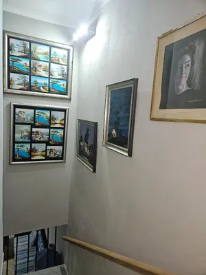 a group of pictures hanging on a wall at Luxury Meets Convenience Near City & Travel Links in Pretoria