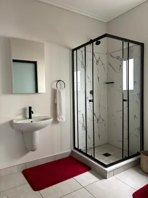 a bathroom with a shower and a sink at The Dream Escape At The Blyde - Lagoon Facing 3 Bedroom Apartment in Pretoria