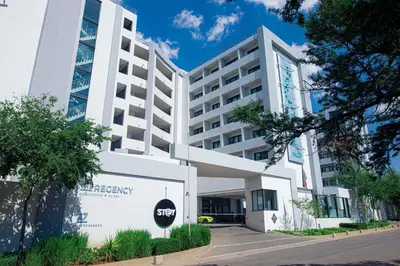 an office building with a stop sign in front of it at Regency Apartment Hotel Unit 311 in Pretoria