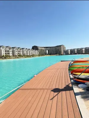 a group of boats sitting on a dock in the water at Diamond Suite Munyaka in Midrand
