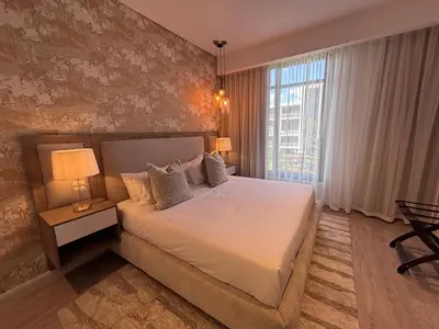 a bedroom with a bed and a large window at Signature Luxury Living Experience - The Trilogy Collection in Pretoria