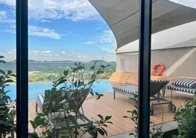 a view from the balcony of a house at Deluxe fully furnished apartment in Menlyn Maine residence 902 in Pretoria