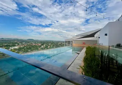 a swimming pool on the roof of a building at Deluxe fully furnished apartment in Menlyn Maine residence 902 in Pretoria