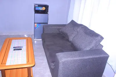 a couch sitting in a living room with a table at Exodus Guesthouse Mahlakwena Stee'lpoort in Steelpoort