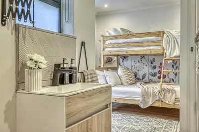a small kitchen with a bunk bed in a room at Pecanwood Summit Shores Villa in Hartbeespoort