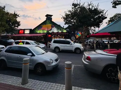 a group of cars parked in front of a market at 41 on 20th in Pretoria