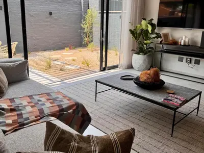 a living room with a couch and a coffee table at 41 on 20th in Pretoria