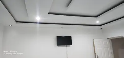 a tv on the ceiling of a room at Thohoyandou P house rooms in Thohoyandou