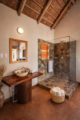 a bathroom with a sink and a shower at Mathendele Bush Lodge in Oporto