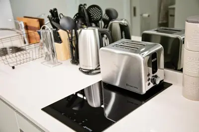 a kitchen counter with a toaster and other appliances at Ad Astra Studio Apartment - Waterfall in Midrand