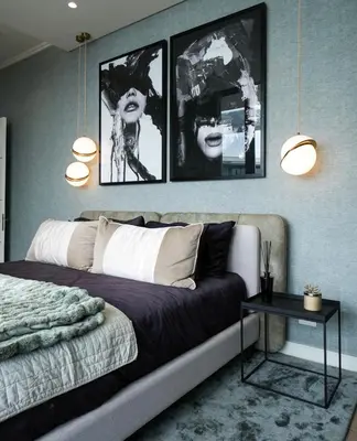 a bedroom with a couch and two pictures on the wall at Serenity Getaway in Midrand