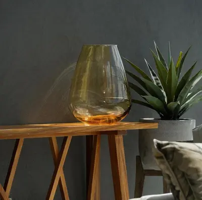 a wine glass sitting on top of a wooden table at Serenity Getaway in Midrand