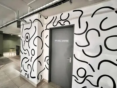 a room with a door with graffiti on the wall at Circa Urban Suite in Pretoria