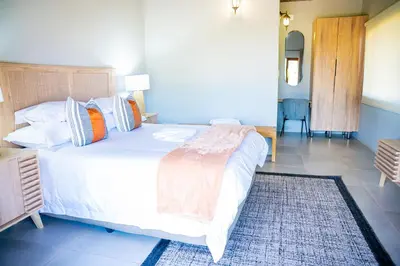 a bedroom with a large white bed and a rug at Collen Pillar Hotels, Windsor Royale