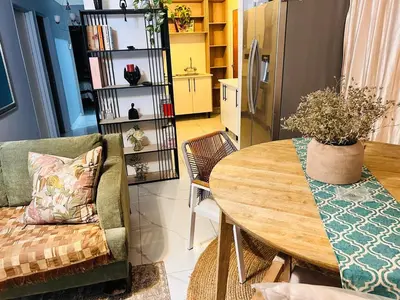 a living room with a table and a couch at 33OnPangolin B&B in Nelspruit