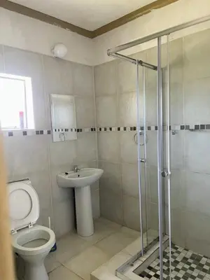 a bathroom with a toilet and a sink at Guest house at 17 Arnot