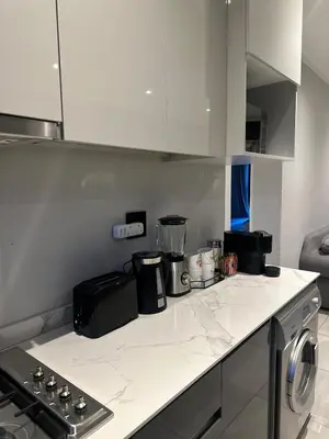 a kitchen with a counter top with appliances on it at Modern Comfort in the Heart of Pretoria the Jacaranda City in Pretoria