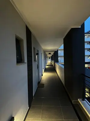 a corridor of an office building with a long hallway at Modern Comfort in the Heart of Pretoria the Jacaranda City in Pretoria
