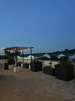 a view of a patio with plants and a pavilion at Modern Comfort in the Heart of Pretoria the Jacaranda City in Pretoria