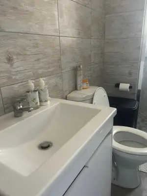 a bathroom with a white sink and a toilet at Kumba Mzansi in Musina