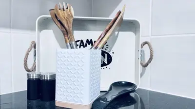 a knife block with utensils in it on a counter at Casa Tranquila Luxe in Pretoria