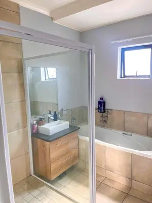 a bathroom with a sink and a bath tub at Chillasclub BNB-SAFUBI VIEWS in Nelspruit
