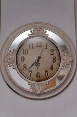 a clock in a mirror on a wall at 22 On End luxurious & modern yet private escape in Centurion