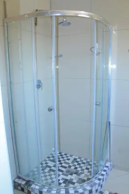 a shower with a glass enclosure in a bathroom at Comfort stay Guesthouse in Mokopane