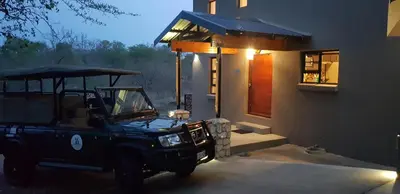 a jeep parked in front of a building at Sweni Lodge 91 Mjejane Kruger Park in Hectorspruit