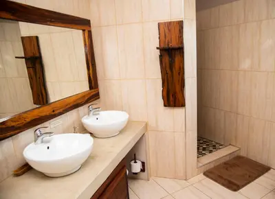 a bathroom with two sinks and a shower at Sweni Lodge 91 Mjejane Kruger Park in Hectorspruit