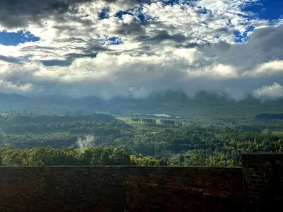 a view of a valley under a cloudy sky at Angel's Rest in Dullstroom