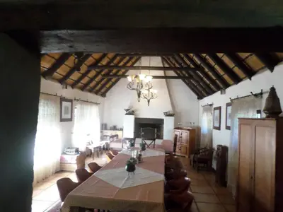 a large dining room with a long table and chairs at Foundry Guest Lodge in Pretoria