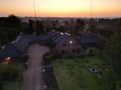 an aerial view of a house with a yard at Owls Loft Guest House in Midrand