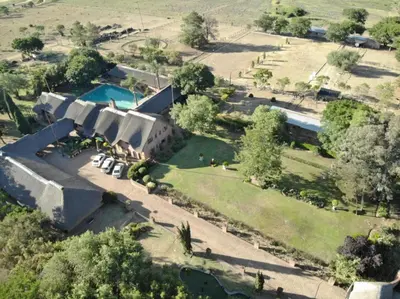 an aerial view of a house with a swimming pool at Owls Loft Guest House in Midrand