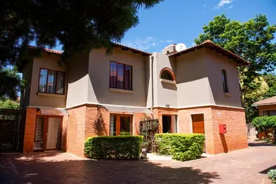 a large house with a brick at 37 on Charles in Pretoria
