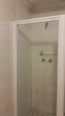 a shower with a glass door in a bathroom at Albatross B&B in Benoni