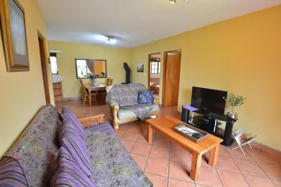 a living room with a couch and a table at Kairos Home in Middelburg