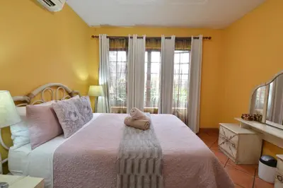 a bedroom with a bed with a stuffed animal on it at Kairos Home in Middelburg