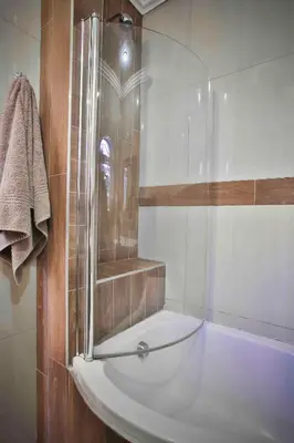 a bathroom with a shower and a white sink at Accommodation at Vans No Loadshedding in Centurion