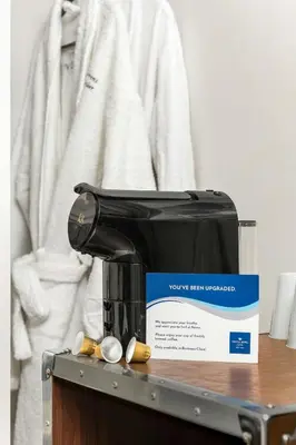 a box sitting on top of a coffee machine at Protea Hotel by Marriott O R Tambo Airport in Kempton Park